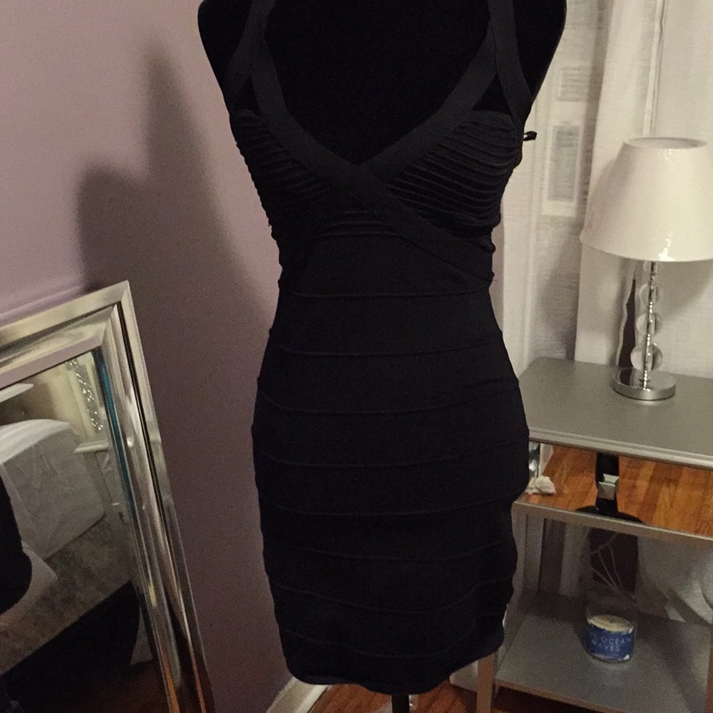 Skin tight black BEBE dress with embellished back